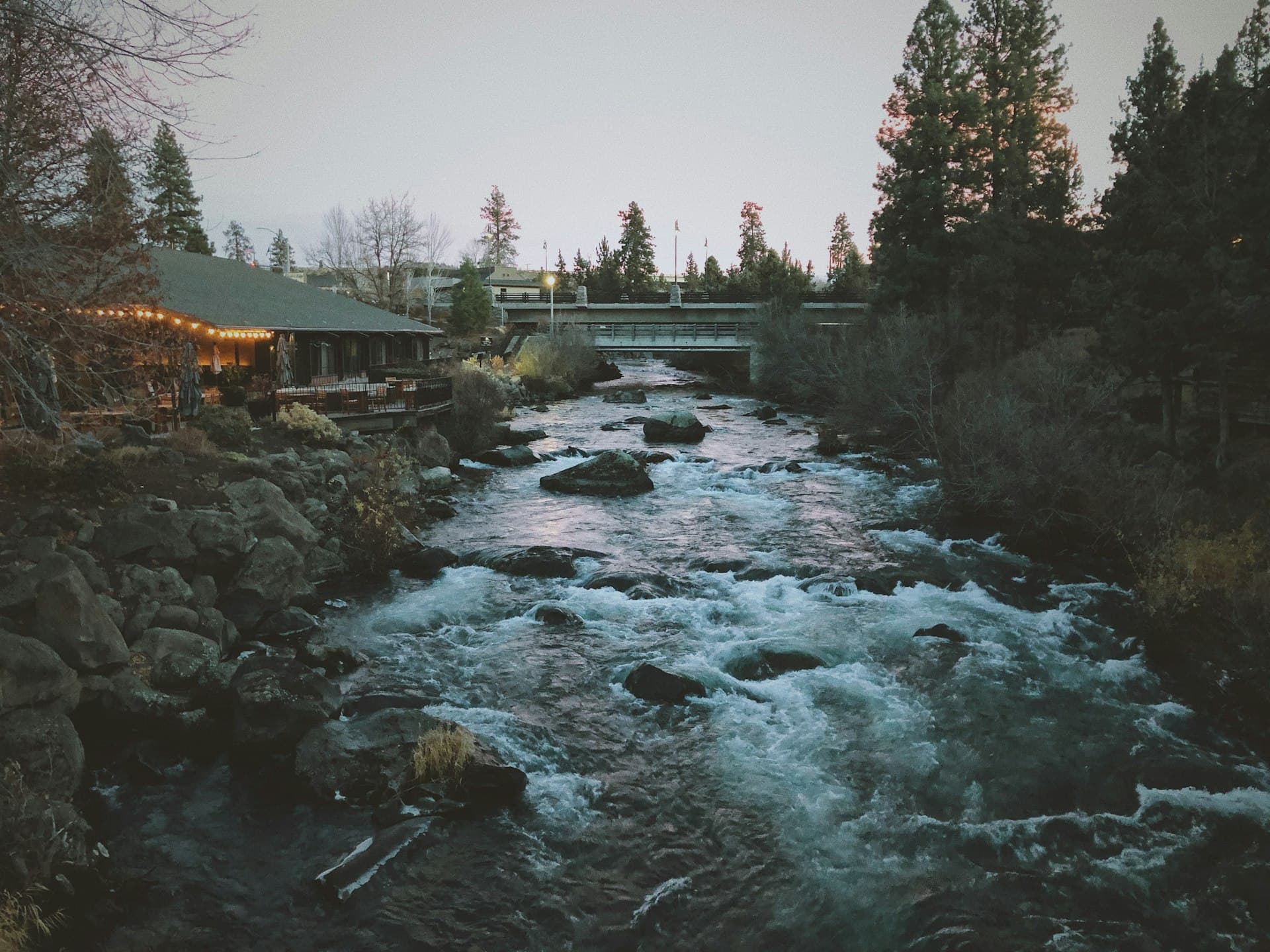 Drake Park and Mirror Pond footbridge in downtown Bend, Oregon on a sunny day