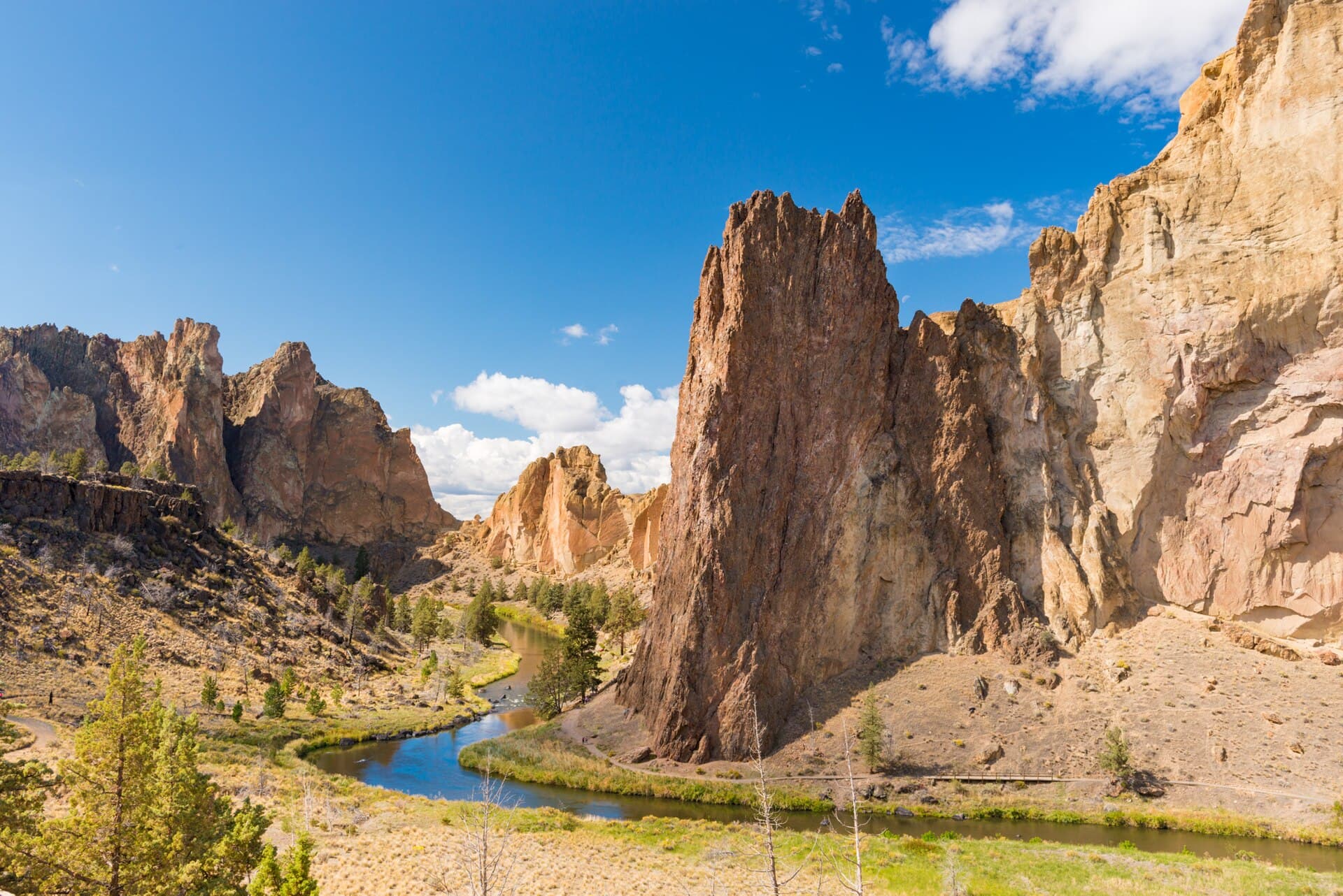 Towering red rock spires of Smith Rock State Park above the winding Crooked River near Redmond, Oregon
