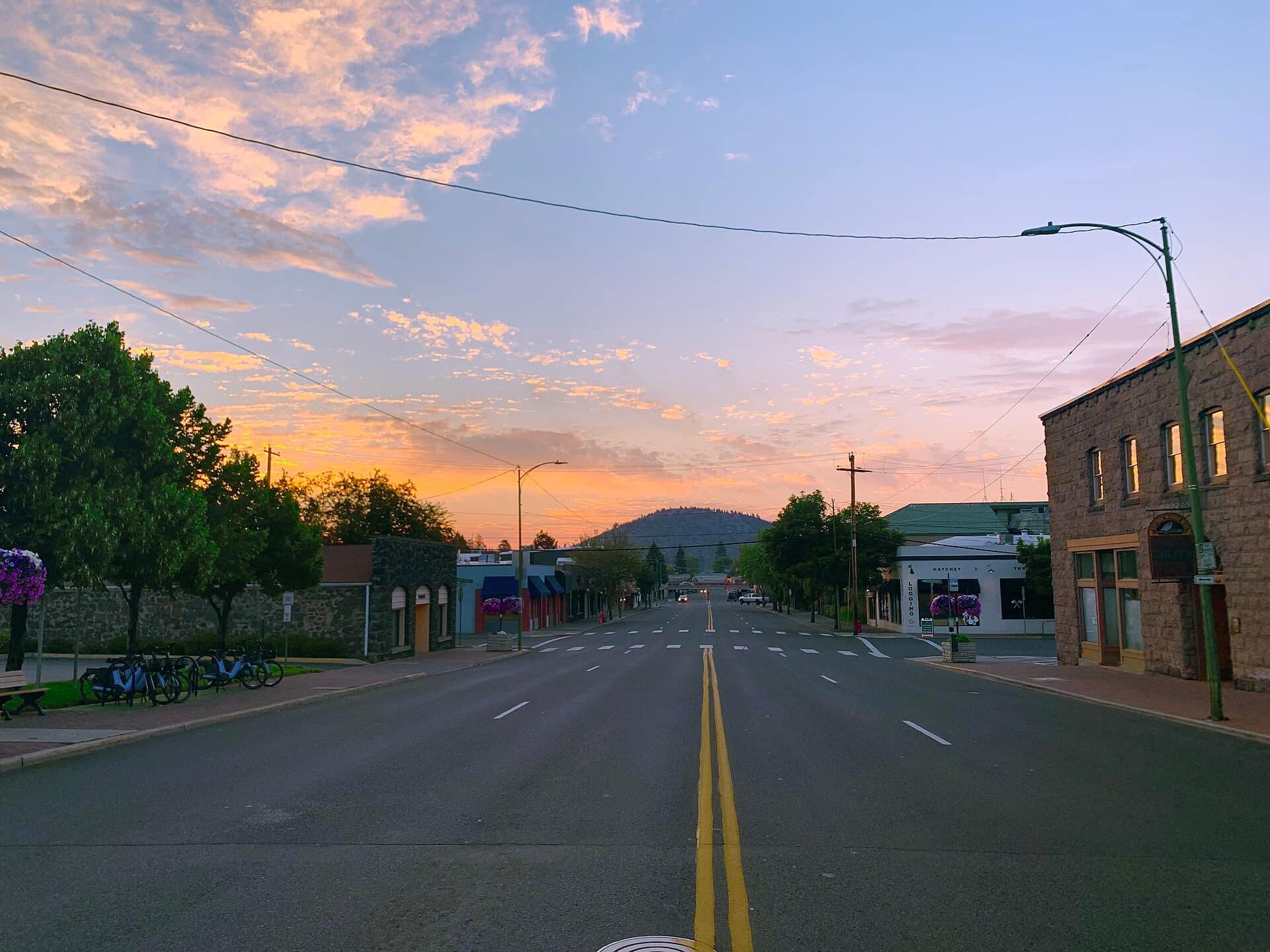 Downtown Bend street view with Pilot Butte rising in the background